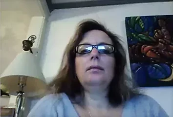 Old gal teases her pussy, rubs tits