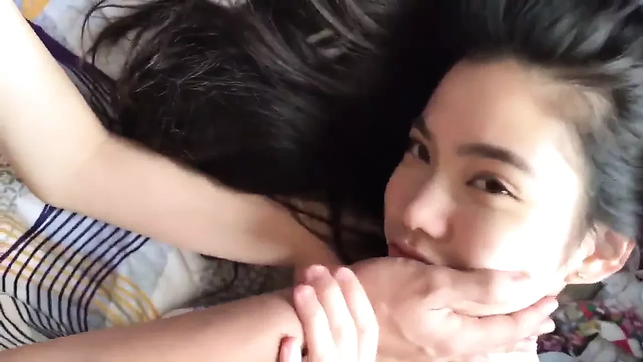 Beautiful Asian in dress giving a blowjob