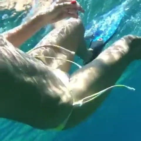 Heidi Klum swimming underwater in a bikini