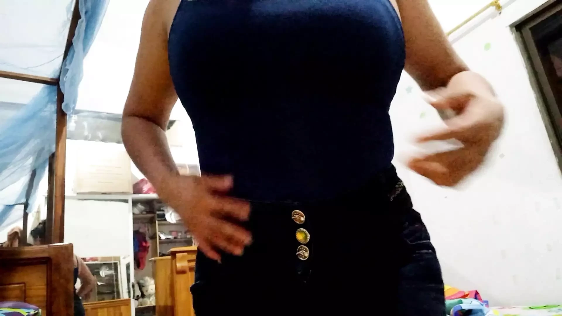 Latina with natural tits uncovers her chest and shows her natural tits