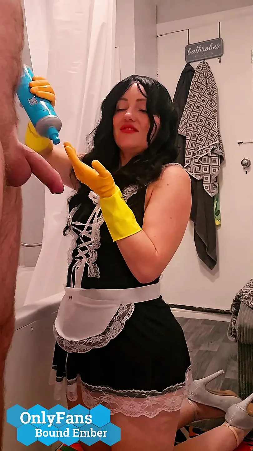 Chubby Milf Maid Bound Ember, gives handjob to hotel guest in rubber gloves then takes a cumshot facial