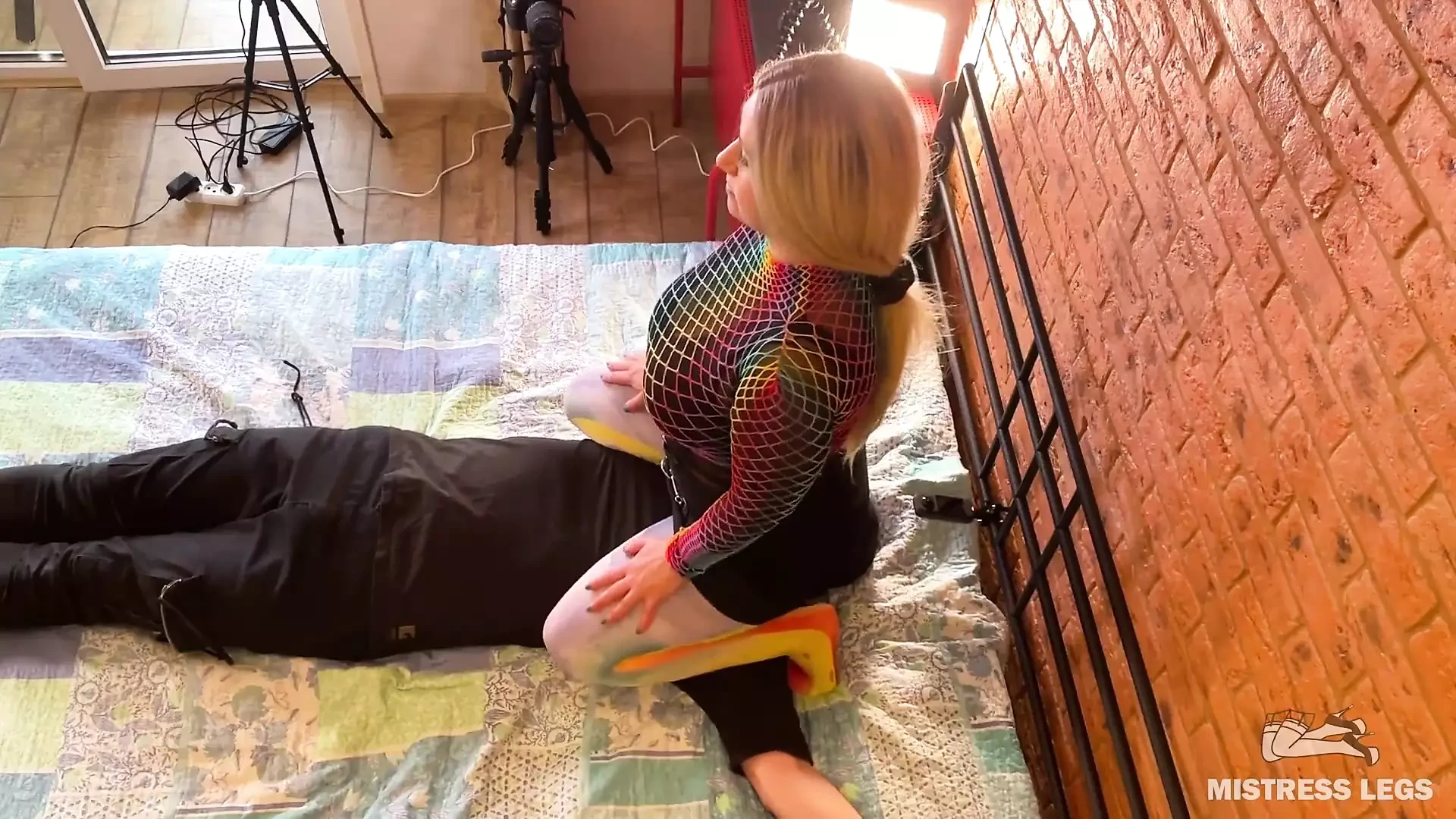 Mistress sitting and bouncing with her big nylon ass on slave face