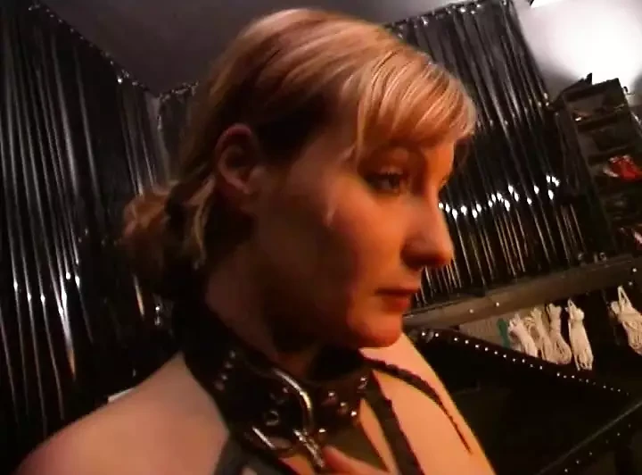 Master brings his slave to the dominatrix